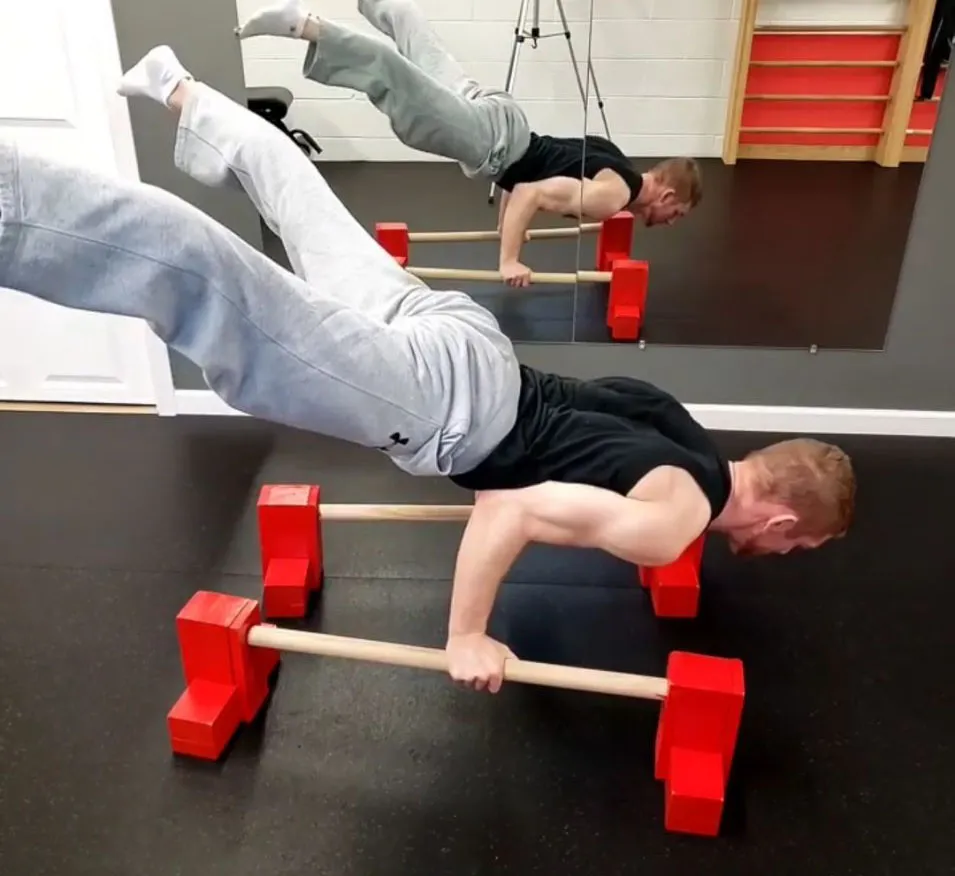 Bennett Dahl demonstrating a controlled bodyweight movement