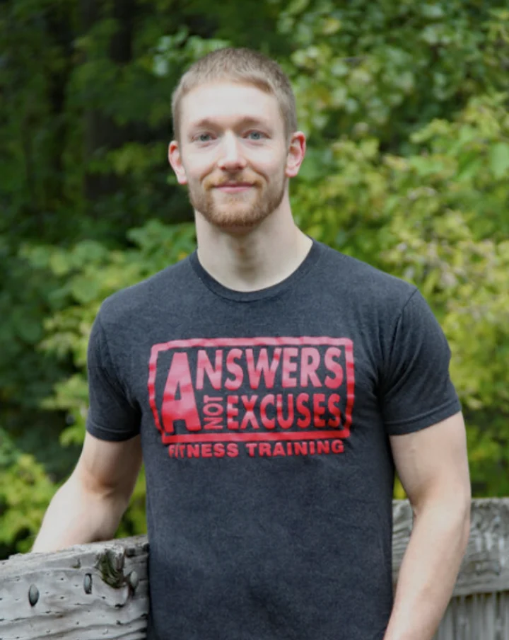 Bennett Dahl wearing an Answers Not Excuses training shirt
